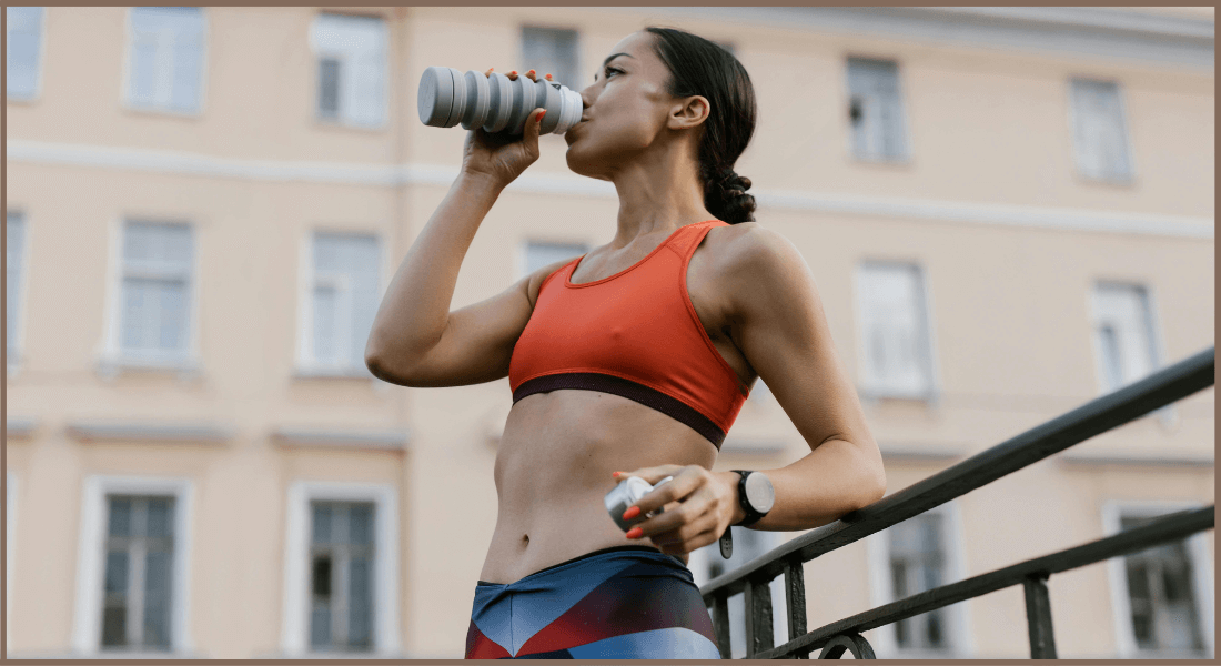 A Women Posing In Fitness Bra Manufactured By The Best Fitness Wear Manufacturer