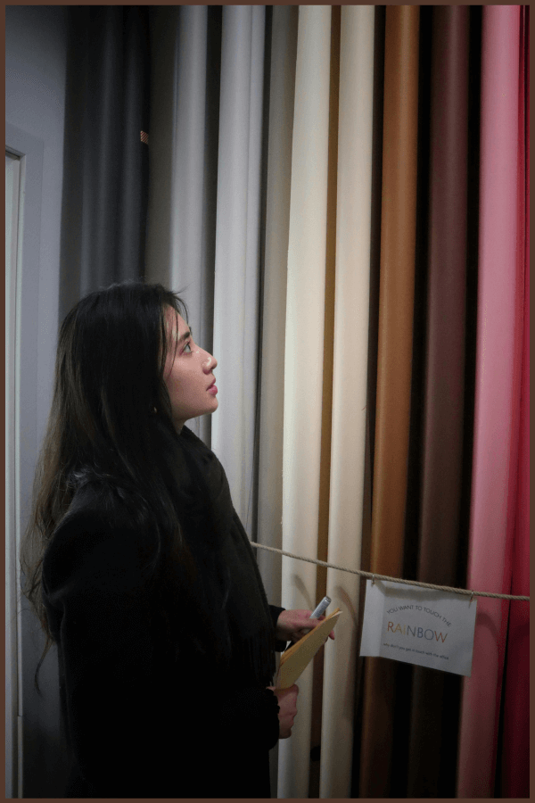 A Women During Selection Of Fabric For Yoga Wears