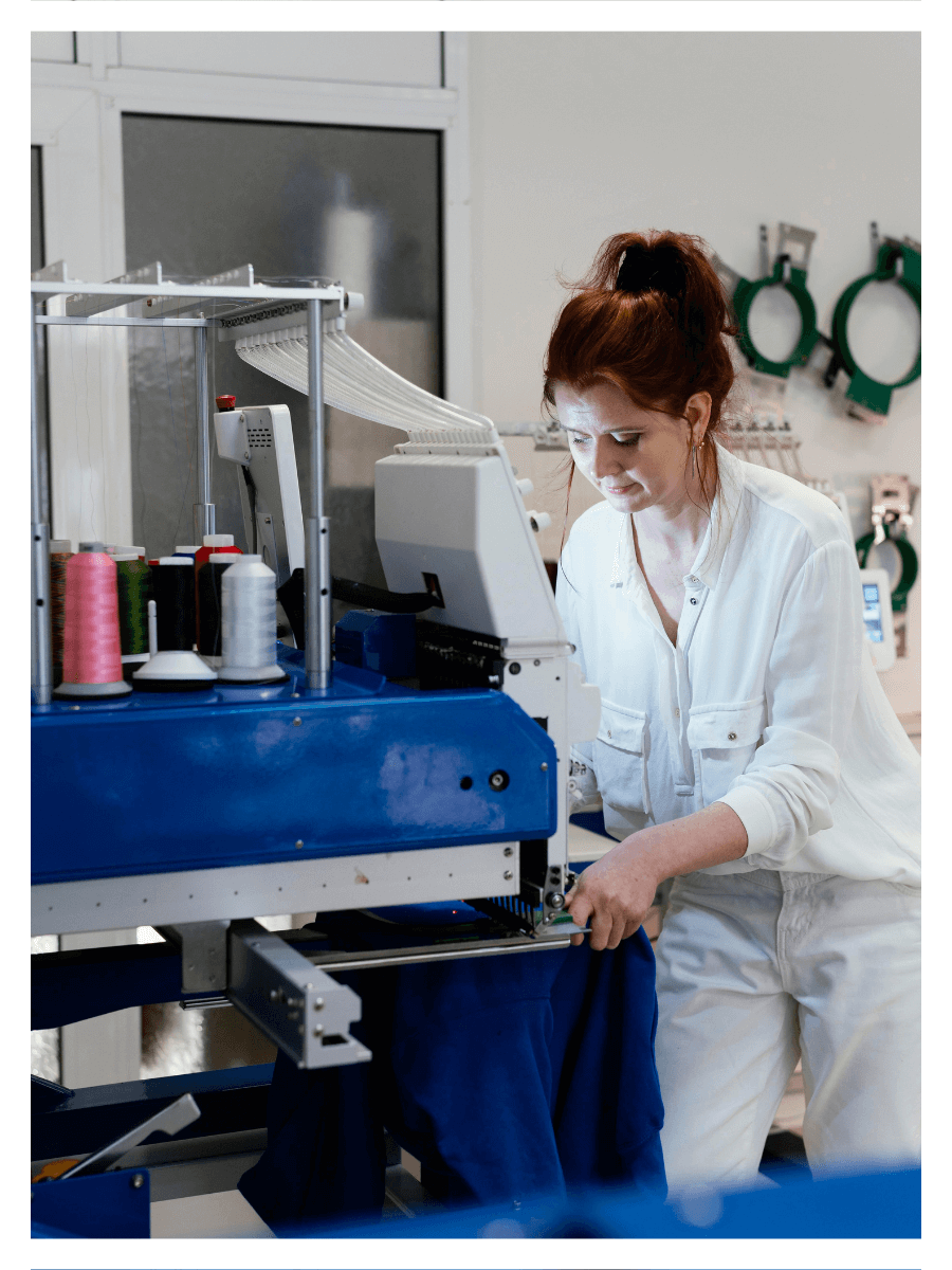 Female Doing Embroidery In Clothing Manufacturing Company